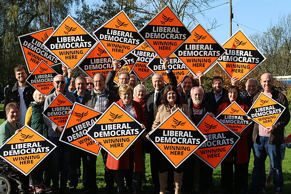 A large group of people holding up Lib Dem Diamonds 